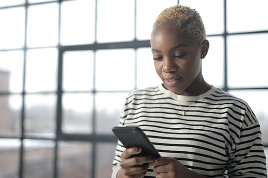 young lady looking at mobile phone