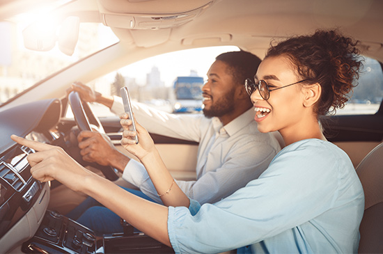 young couple enjoying road trip